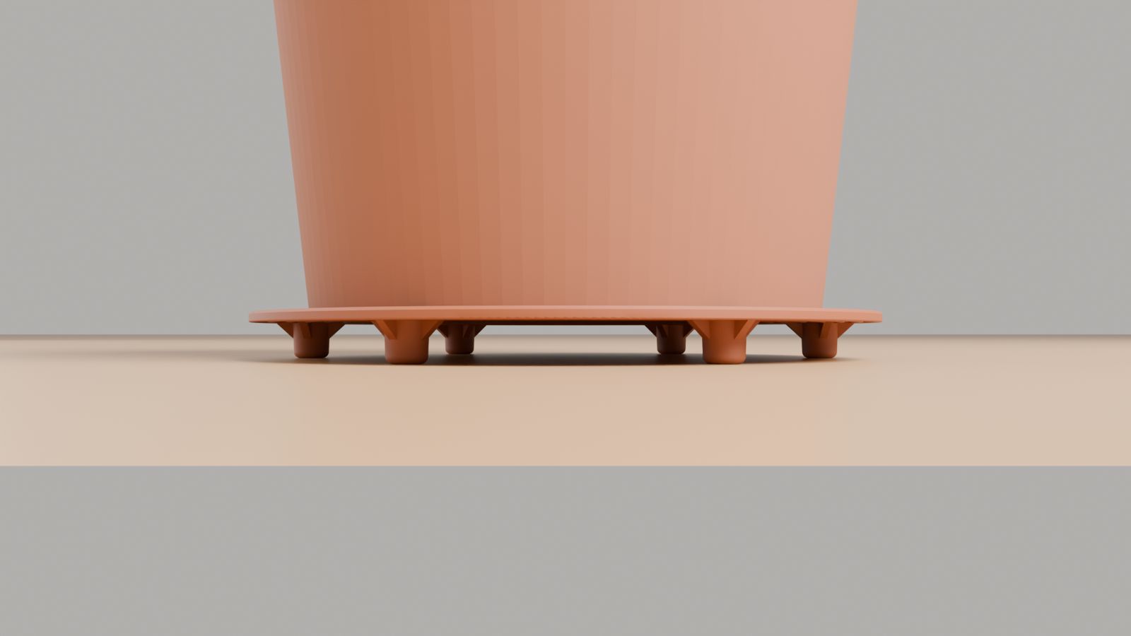 Side view of a planter on a HomeHalo ring showing the space between pot and floor